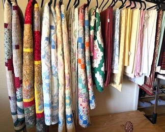 Assorted handmade quilts, table cloths