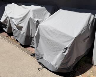 Hiding underneath those covers are Sunbrella patio armchairs and a full-sized couch!