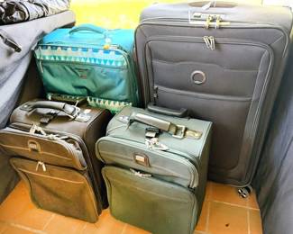 Luggage, including large Delsey suitcase new with tag