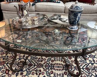 Big oval glass topped coffee table.