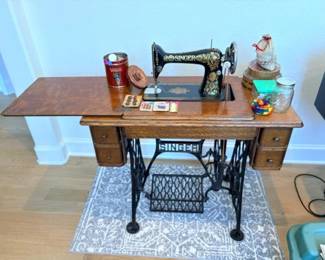 Singer treadle set up with antique buttons and containers