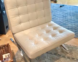 One of a pair of white leather Barcelona chairs ( frames are bent )