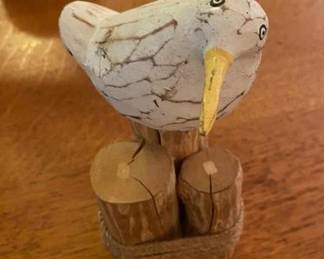 Hand-Carved Wooden Bird, Distressed White on Wood Pilings