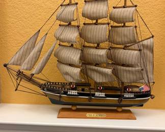 Decorative model is a vintage Pride of Baltimore II wooden and fabric ship replica.