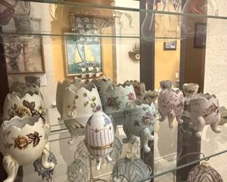 Collection of decorative, Fabergé-style egg trinket boxes, footed porcelain eggshell vases.