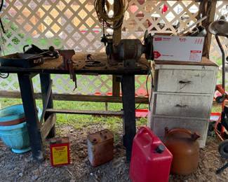 Work table with vice and bench grinder.