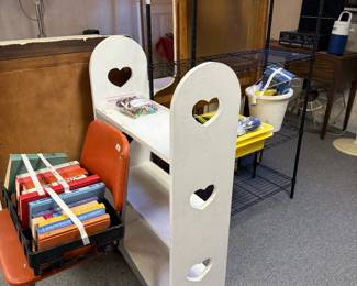 Metal shelf, book shelf, old books and chair