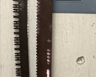 We have a total of three antique cross cut saws!