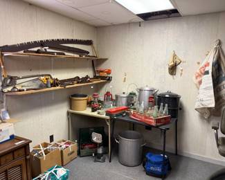 Vintage tools, stock pots, oyster pot, coke bottles, lanterns, old feed sacks, camp stove and an awewome hand crank ice cream churn