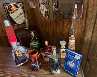 Nice collection of bar bottles and cups.