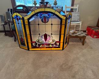 Awesome Stained Glass fireplace screen with light.