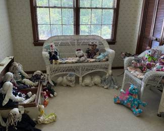 Wicker set; many handcrafted stuffed animals and trunk.