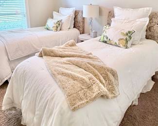 Twin beds, upholstered headboards, bedding also for sale