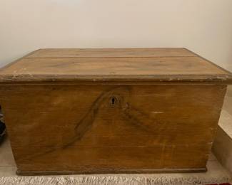 Antique pine trunk with iron strap hinges and key. 