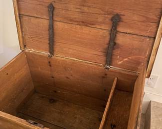 Antique pine trunk with iron strap hinges and key. 
