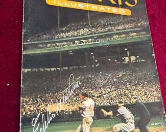 Sports Illustrated signed by Eddie Matthews with baseball cards inside.