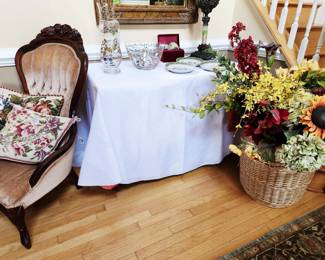 Antique Chair and Needle Point Pillows; silk flowers by stem; Crystal Pitcher and Bowl