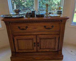 Oak buffet the top opens up for more surface area.