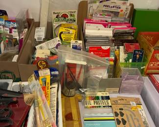 Crafting supplies, paintbrushes, oil pastels