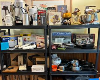 Large selection of vintage kitchen appliances and cookware