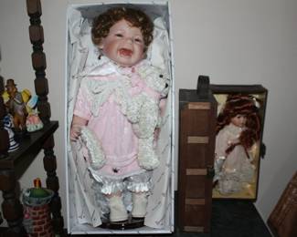 Doll in wooden box
