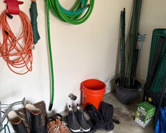 hose, outdoor electric extension cord, garden boots, and garden stakes