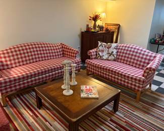 Another view of the matched set: single-cushion couch and loveseat and shown with square coffee table with stripped area rug