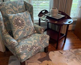 Occasional accent armchair and side table with wool rug shown below