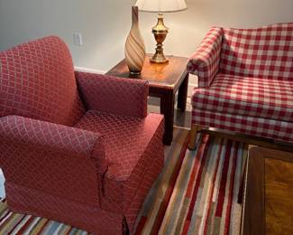 Another view of the armchair and side table with lamp and striped vase