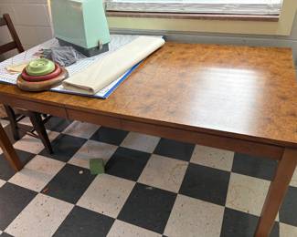 burled wood dining table and sewing notions