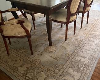 Dining table (one additional leaf) with 6 chairs and shown with area rug 9 x 12