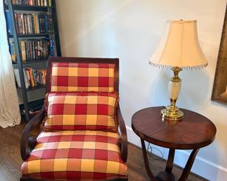 Another view of the armchair, side table and lamp and angled black bookcase (2 available) with books