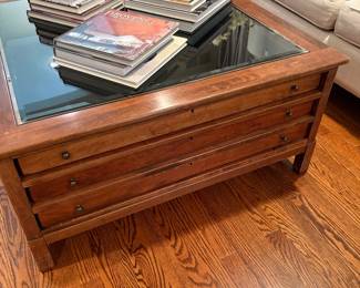 3-drawer square storage coffee table with display top and shown with coffee table books