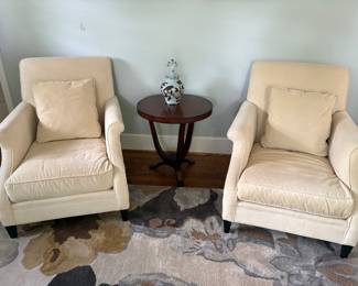 Another view of the RESTORATION HARDWARE ARMCHAIRS, round side table and floral area rug