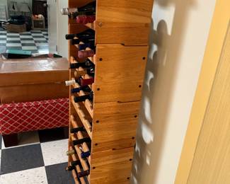 Wood wine storage rack and top rack has glass storage area