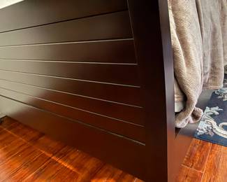 Close up of master bedroom queen bed frame (foot of bed)