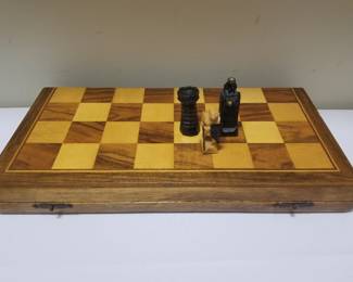 Chess board with carved wooden figures