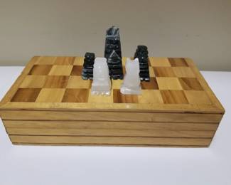 Chess board with carved stone figures
