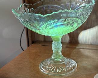 vintage pedestal compote bowl features a vibrant green glow under UV light