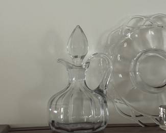 vintage glass cruet decanter with a stopper, glows bright under UV light