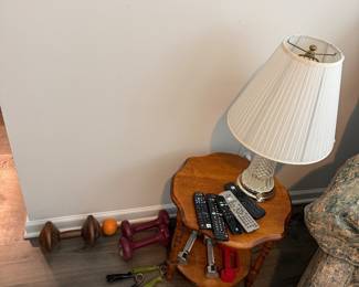 Lamp with textured glass base, side table, various small hand weights