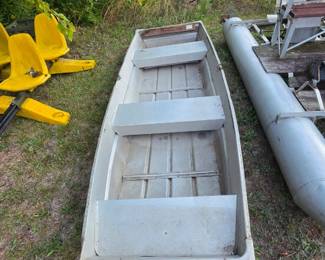 Aluminum boat, yellow seats, and pontoon