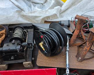 Winch, hose reel, and jack stands