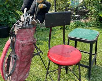 older golf clubs and vintage chair/ stool