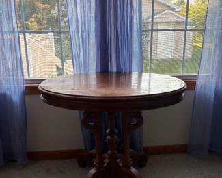 Oval Occasional Table with Carved Base