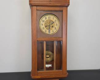 Lot #30 - Vintage Echo Gong Wall Clock with Ornate Brass Dial and Wooden CaseLot #30 - Antique 1920s German Echo Gong Regulator Wall Clock with Ornate Brass Dial and Wooden Case