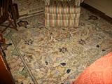 Beige floor rug approx. 9 feet by 7 ft.