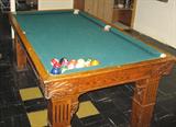 Tiger oak pool table with slate top, balls & 3 cue sticks. Measures 40 1/2 inches wide by 6 ft. 1" long. Reported to have been acquired from a tavern in Dyer, IN in 1957.