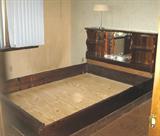 Bed frame with mirrored bookcase