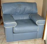 One of 2 leather comfort chairs